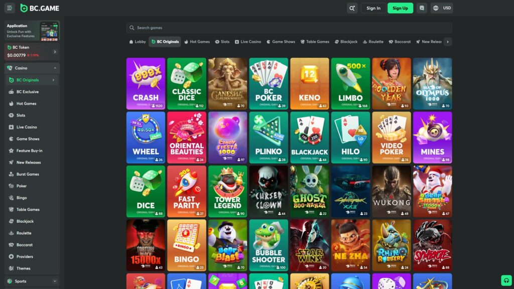 BC.GAME crypto casino BC Originals games lobby displayed with the BC Originals tab actively highlighted in the secondary navigation alongside Lobby, Hot Games, Slots, Live Casino, Game Shows, Table Games, Blackjack, Roulette, Baccarat and New Releases categories, comprehensive five-row grid of in-house developed blockchain games including the flagship Crash with vibrant 999x rocket art (1,520 players), green Classic Dice (112), Ganesha Golden Wheel (70), BC Poker (39), Keno (62), Limbo (168) with rocket imagery, Asian-themed Golden Year (93), mythological Sea of Olympus 1000 (70), Wheel showing 39.6x/49.50x/19.8x multiplier ring (26), pink Oriental Beauties (24), Candy Fiesta 1000 (97), Plinko with 2.1x and 420x highlighted (28), Blackjack (44), Hilo HI/LO card game (90), Video Poker (74), Mines (98), green Dice (88), red rocket Fast Parity 20s (27), Tower Legend (90), horror-themed Cursed Clown (44), Ghost Boo-Nanza (22), Cyberpunk XXII (23), Wukong (48), Bear Smash 15000x Boost (67), Torture Block 15000x (43), Bingo (23), Bear Blast (70), Bubble Shooter (100), Star Wins (20), Ne Zha (54), Rhino Robbery (24) and Symbiote (88), search games bar at the top, expanded left sidebar showing Casino menu with BC Originals (active highlighted), BC Exclusive, Hot Games, Slots, Live Casino, Game Shows, Feature Buy-in, New Releases, Burst Games, Poker, Bingo, Table Games, Blackjack, Roulette, Baccarat, Providers, Themes plus Sports navigation, BC Token at $0.00779 (-1.19%), Application banner promoting exclusive features, Dark/Light theme toggle, English language and USD currency selectors, plus Sign In and Sign Up CTAs in the top-right header