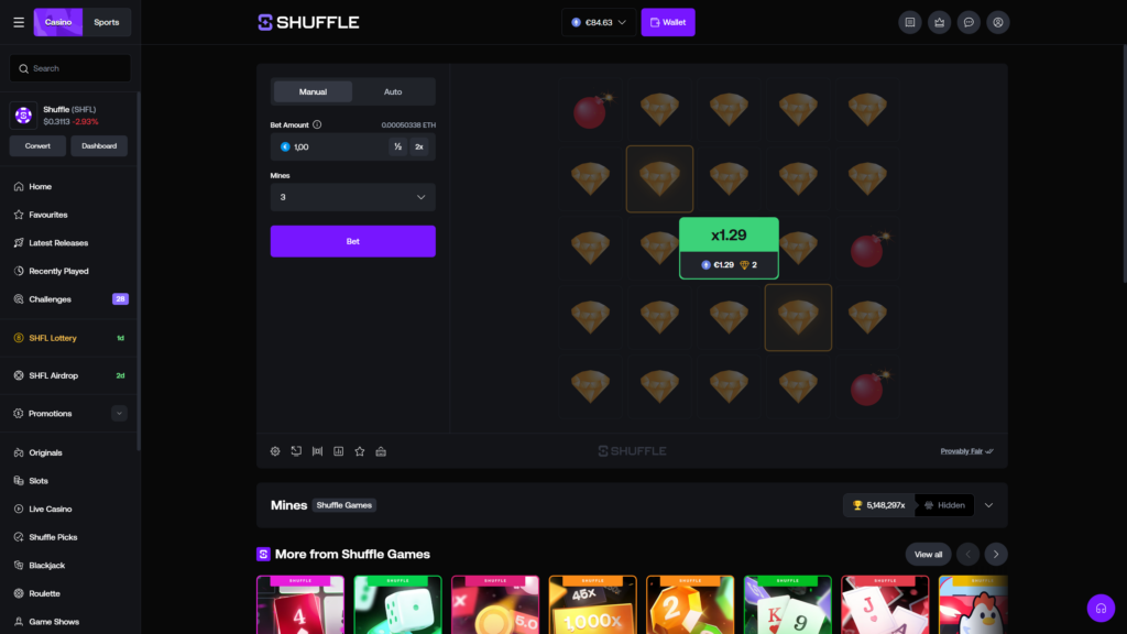 Shuffle.com Mines crypto casino game victory screen showing a successful cashout with a bright green x1.29 multiplier popup overlay centered on the 5x5 game board, payout summary of €1.29 with 2 gems collected icon, full board reveal exposing 3 red bomb tile positions in the top-left, middle-right, and bottom-right corners surrounded by 22 golden diamond gem tiles, the two originally selected winning gem tiles highlighted with orange borders in the second and fourth rows, ETH wallet balance increased to €84.63 reflecting the win, ready-to-play Bet button on the left panel, and the dark-themed Shuffle interface featuring the purple branded sidebar navigation