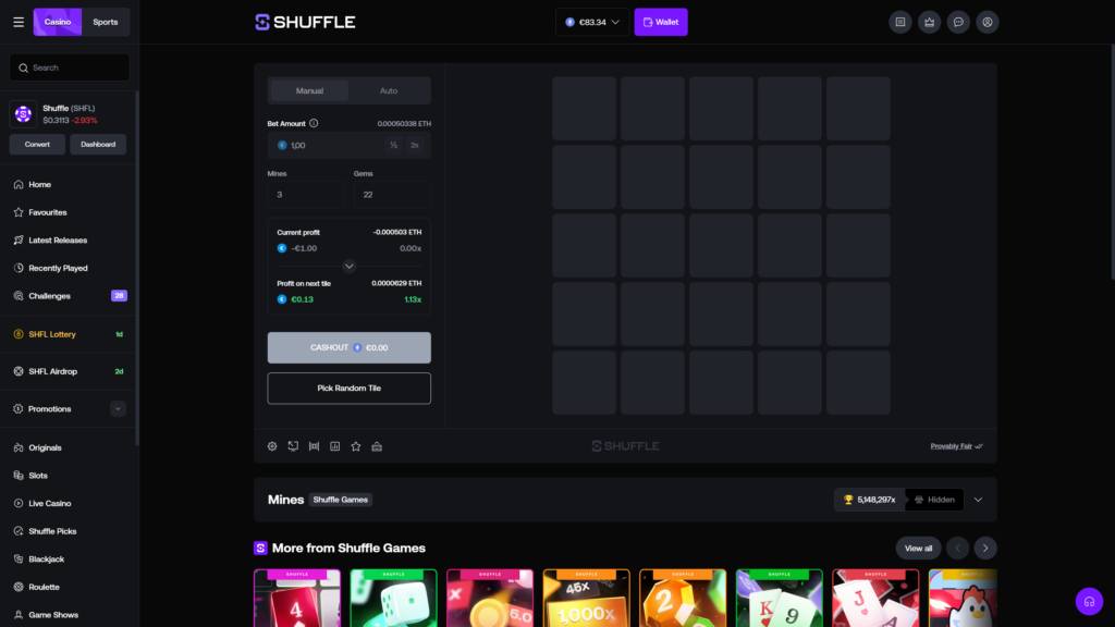 Shuffle.com Mines crypto casino game shown in pre-pick state with a fresh untouched 5x5 grid board, configured with €1.00 bet amount (0.00050338 ETH), 3 mines and 22 gems selected in Manual mode, current profit panel showing -€1.00 at 0.00x reflecting initial wager deduction, profit on next tile preview of €0.13 (0.0000629 ETH) at 1.13x multiplier, greyed-out Cashout button at €0.00, Pick Random Tile option below, ETH wallet balance €83.34, Shuffle branding centered in the dark navy header, and the full game sidebar with Favourites, Latest Releases, Recently Played, Challenges (28), SHFL Lottery, and SHFL Airdrop menu items